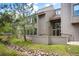 Modern home featuring unique architecture, a well maintained green lawn, and a beautiful tree at 23612 Pondview Pl # A, Golden, CO 80401