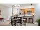 Cozy open kitchen with stainless steel appliances, breakfast bar and adjacent dining area at 23612 Pondview Pl # A, Golden, CO 80401