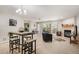 Bright living room featuring neutral carpet, fireplace, and large glass doors leading to outdoor space at 23612 Pondview Pl # A, Golden, CO 80401