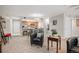 Open concept living room with kitchen, neutral paint, carpeted floors, and comfortable seating at 23612 Pondview Pl # A, Golden, CO 80401