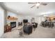 Bright living room with fireplace, neutral carpet and open access to kitchen at 23612 Pondview Pl # A, Golden, CO 80401