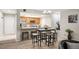 Cozy open kitchen with stainless steel appliances, breakfast bar and adjacent dining area at 23612 Pondview Pl # A, Golden, CO 80401
