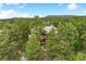 Aerial shot of the luxurious secluded home, nestled amongst lush treetops at 646 Ruby Trust Dr, Castle Rock, CO 80108