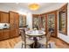 Breakfast nook with custom wood shutters, hardwood floors, and elegant lighting at 646 Ruby Trust Dr, Castle Rock, CO 80108