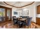 Dining room features hardwood floors, modern lighting, and access to outdoor patio at 646 Ruby Trust Dr, Castle Rock, CO 80108