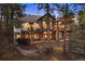 Back of home features multiple balconies with views of wooded surroundings at 646 Ruby Trust Dr, Castle Rock, CO 80108