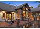 Outdoor living space featuring a balcony with comfortable seating, stone accents, and a built-in grill at 646 Ruby Trust Dr, Castle Rock, CO 80108