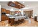 Gourmet kitchen featuring a large island, custom cabinets, granite countertops, and seating for four at 646 Ruby Trust Dr, Castle Rock, CO 80108