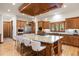 Gourmet kitchen features a large island, custom cabinets, granite countertops, and stainless steel appliances at 646 Ruby Trust Dr, Castle Rock, CO 80108