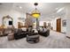 Comfortable living room featuring stone accent columns, a fireplace, and an inviting bar area at 646 Ruby Trust Dr, Castle Rock, CO 80108