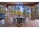 Covered outdoor patio area with stone columns and wood beams perfect for entertaining at 646 Ruby Trust Dr, Castle Rock, CO 80108