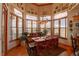 Bright dining room with hardwood floors, large windows, decorative plates and a beautiful view at 2941 Castle Butte Drive Dr, Castle Rock, CO 80109