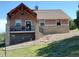 Charming home with a deck, stone accents, and a hammock underneath at 2941 Castle Butte Drive Dr, Castle Rock, CO 80109