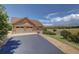 Spacious two-car garage with an extended driveway and picturesque countryside views at 2941 Castle Butte Drive Dr, Castle Rock, CO 80109