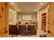 Home theater with comfortable seating, a large screen, and built-in shelving for media storage at 2941 Castle Butte Drive Dr, Castle Rock, CO 80109