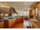 Well-appointed kitchen with granite countertops, a center island, and hardwood floors, perfect for meal preparation at 2941 Castle Butte Drive Dr, Castle Rock, CO 80109