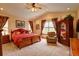 Spacious main bedroom featuring vaulted ceilings, a ceiling fan, lots of natural light, and a seating area at 2941 Castle Butte Drive Dr, Castle Rock, CO 80109