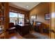 Private home office with wood accents, large windows offering scenic views, and ample workspace at 2941 Castle Butte Drive Dr, Castle Rock, CO 80109