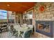 Charming outdoor patio with a fireplace, comfortable seating and scenic views at 2941 Castle Butte Drive Dr, Castle Rock, CO 80109