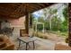 A covered patio with stone columns, outdoor furniture, and a view of the backyard at 2941 Castle Butte Drive Dr, Castle Rock, CO 80109