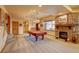 Spacious recreation room with a pool table, stone fireplace, and ample room for entertaining at 2941 Castle Butte Drive Dr, Castle Rock, CO 80109