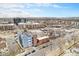 Building with blue and gray panels in an urban setting with nearby buildings at 2460 W 29Th Ave # 204, Denver, CO 80211