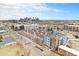 View of the building with blue and gray panels nestled in an urban landscape and cityscape at 2460 W 29Th Ave # 204, Denver, CO 80211