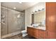 Well-lit bathroom features a glass-enclosed shower, modern fixtures, and plenty of storage at 2460 W 29Th Ave # 204, Denver, CO 80211