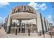 Coffee and tea shop with a large 'The Den' sign on the building's exterior at 2460 W 29Th Ave # 204, Denver, CO 80211