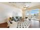 Bright living room featuring hardwood floors, modern decor, and large windows with great natural light at 2460 W 29Th Ave # 204, Denver, CO 80211