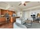 Inviting living room flowing into a modern kitchen with stainless steel appliances at 2460 W 29Th Ave # 204, Denver, CO 80211