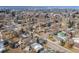 Aerial view of a residential neighborhood showcasing tree-lined streets and well-maintained homes, near urban conveniences at 5895 S Huron St, Littleton, CO 80120