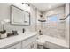 Modern bathroom featuring marble tile, updated fixtures, and a sleek design at 5895 S Huron St, Littleton, CO 80120