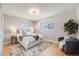 Serene bedroom with ample natural light, soft decor, and hardwood flooring at 5895 S Huron St, Littleton, CO 80120