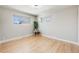 Bright bedroom featuring hardwood floors, and neutral decor at 5895 S Huron St, Littleton, CO 80120