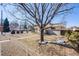 Charming home with a well-maintained front yard and mature tree at 5895 S Huron St, Littleton, CO 80120