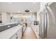 Stylish kitchen featuring white cabinetry, stainless steel appliances, and a functional layout at 5895 S Huron St, Littleton, CO 80120