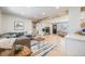 Inviting living room with cozy gray sofa, fireplace, and light hardwood flooring throughout at 5895 S Huron St, Littleton, CO 80120