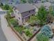 Well maintained backyard with wooden fence, lush landscaping, and privacy at 2908 Open Sky Way, Castle Rock, CO 80109