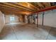 Unfinished basement with exposed beams and mechanicals at 2908 Open Sky Way, Castle Rock, CO 80109