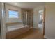 Bright bathroom featuring a soaking tub, and glass enclosed shower at 2908 Open Sky Way, Castle Rock, CO 80109