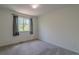 Spacious bedroom with neutral carpet and large window at 2908 Open Sky Way, Castle Rock, CO 80109