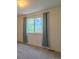 Sunlit bedroom with neutral carpet and double hung window at 2908 Open Sky Way, Castle Rock, CO 80109
