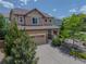 Beautiful two-story home featuring a well-kept lawn and an attached garage at 2908 Open Sky Way, Castle Rock, CO 80109