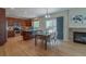 Modern kitchen with stainless steel appliances, a kitchen island with seating, and a dining area nearby at 2908 Open Sky Way, Castle Rock, CO 80109