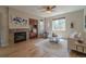 Cozy living room features a fireplace, hardwood floors, natural light, and comfortable seating at 2908 Open Sky Way, Castle Rock, CO 80109