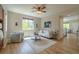 Bright and airy living room with hardwood floors, neutral decor, and ample natural light at 2908 Open Sky Way, Castle Rock, CO 80109