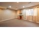 Finished basement with wet bar and neutral decor at 911 Snowberry St, Longmont, CO 80503