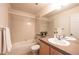 Clean bathroom with tub, shower, and updated vanity at 911 Snowberry St, Longmont, CO 80503