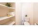 Convenient bathroom with toilet and shelving unit at 911 Snowberry St, Longmont, CO 80503